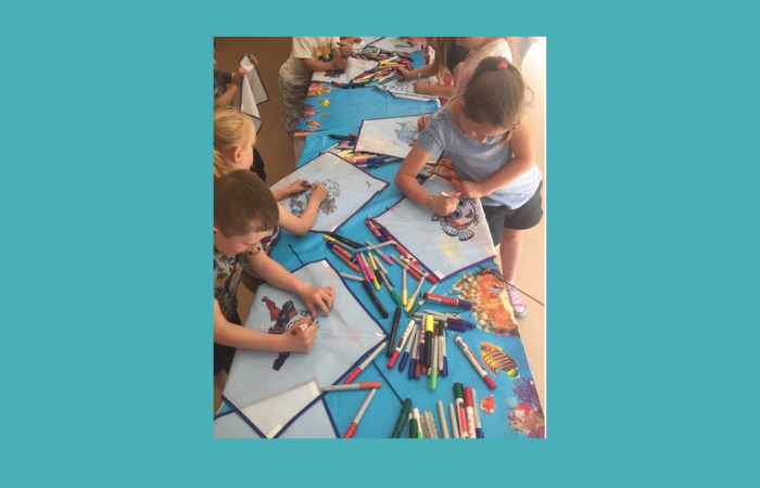 children colouring kites coloured pens having fun