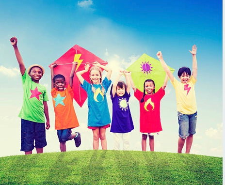 children coloured t shirts holding kites 